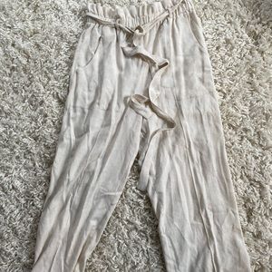 Oatmeal colored pants. Paper bag pants